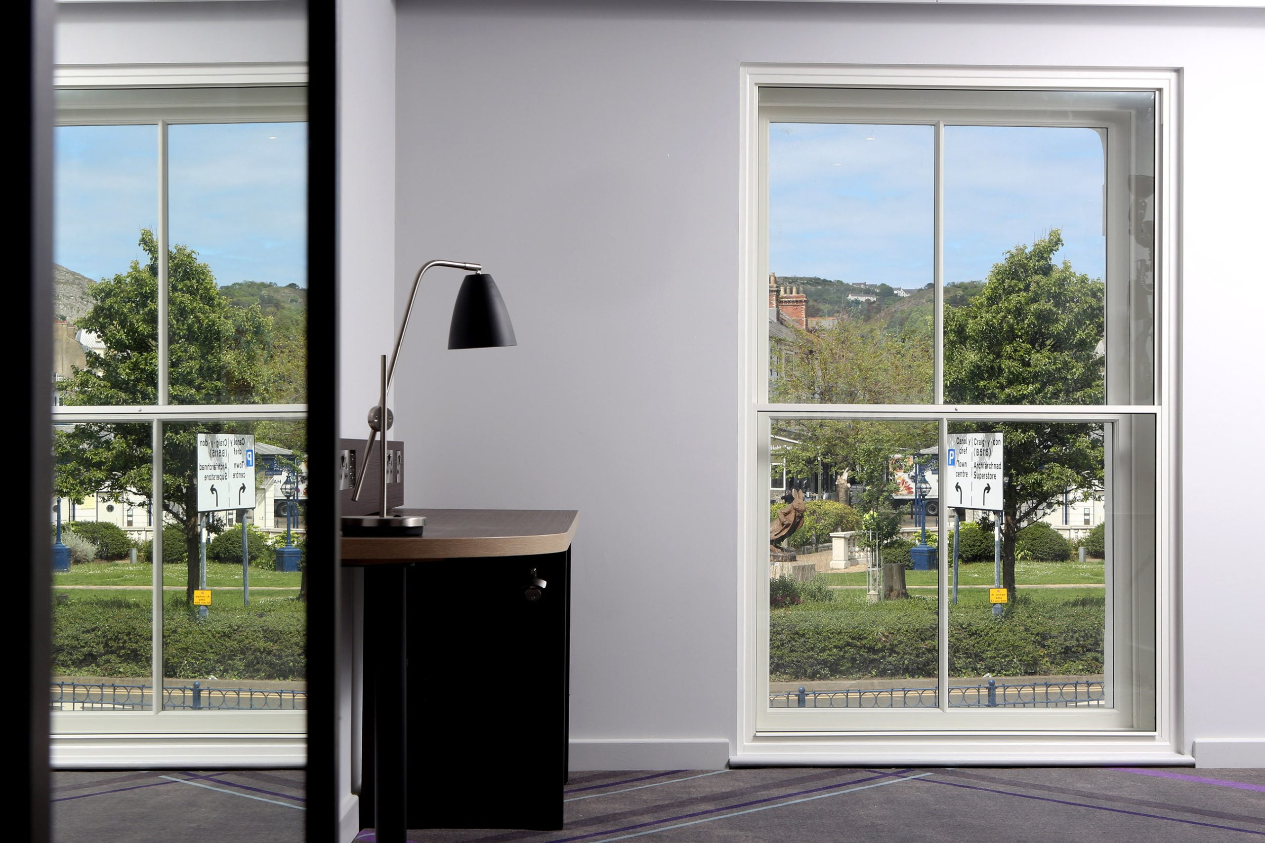 Vertical sliding secondary glazing